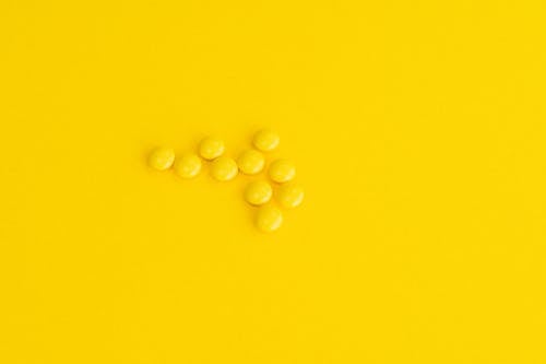 Prescription Drugs on Yellow Surface