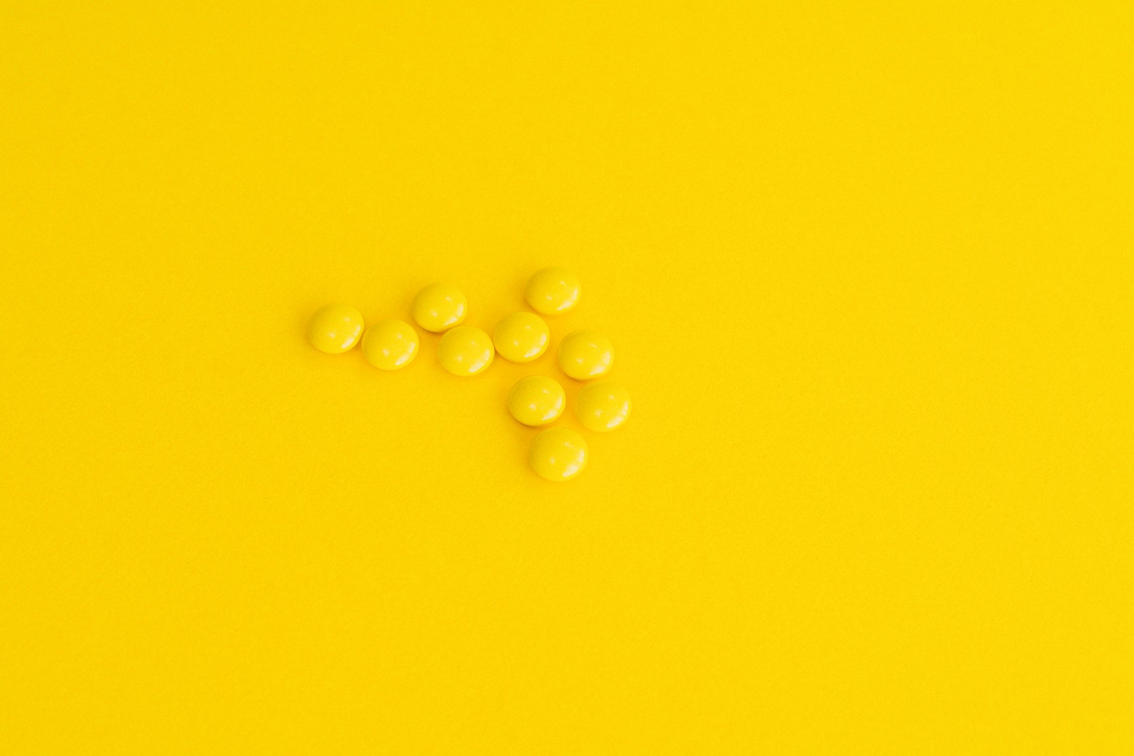 Prescription Drugs on Yellow Surface · Free Stock Photo