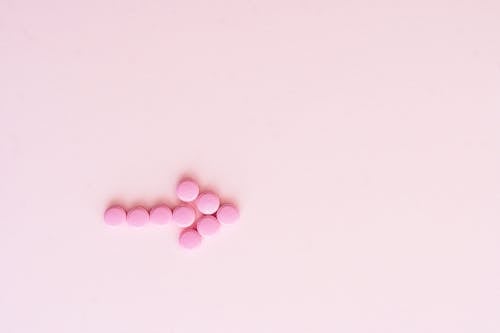 Безкоштовне стокове фото на тему «ліки, планшети, рожева поверхня»