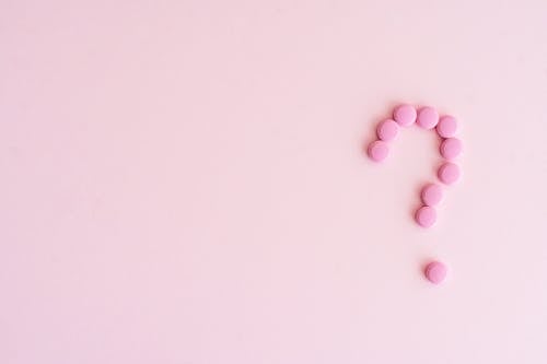 Free Pink Medicines Formed in Question Mark Stock Photo