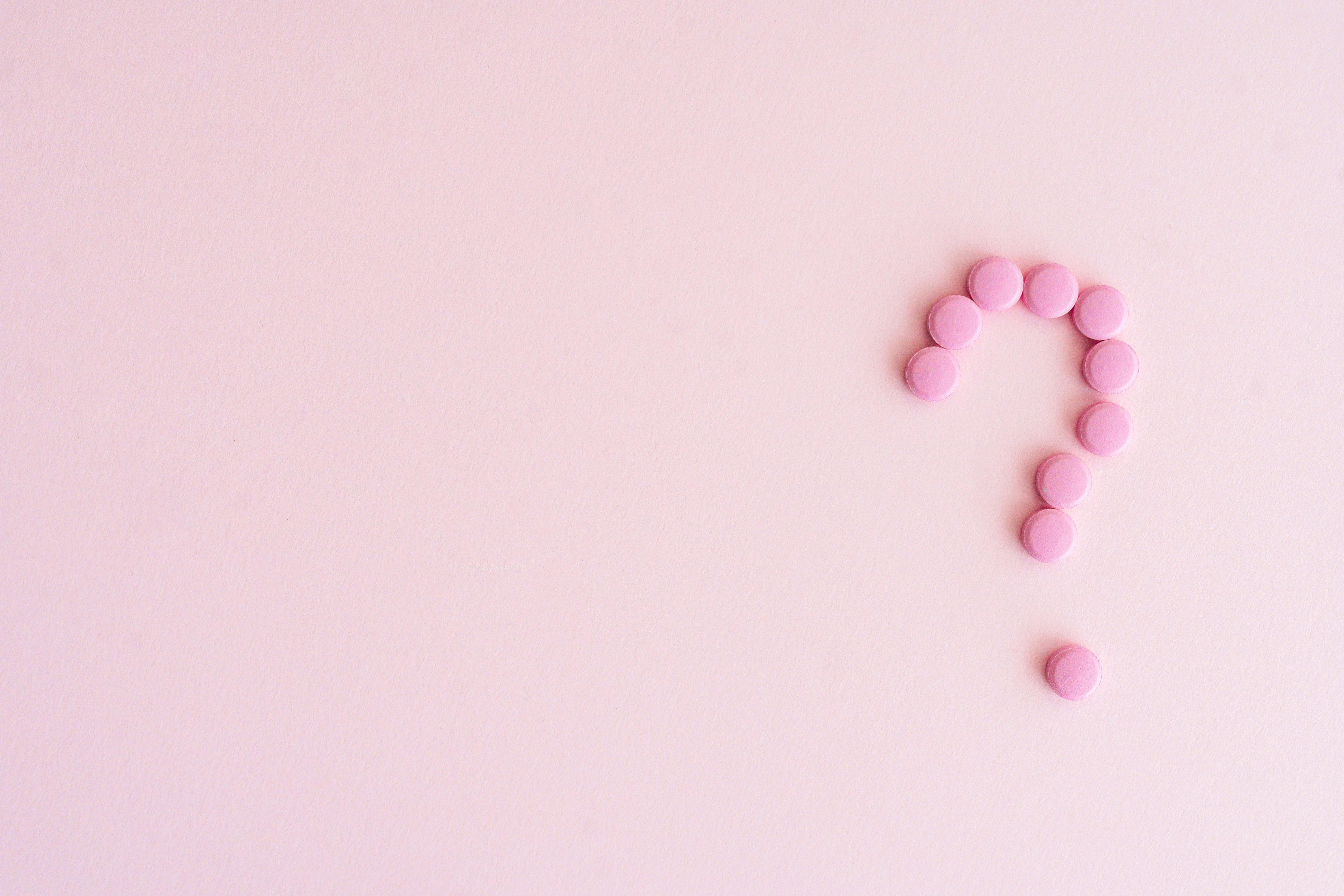 Pink Medicines Formed in Question Mark · Free Stock Photo