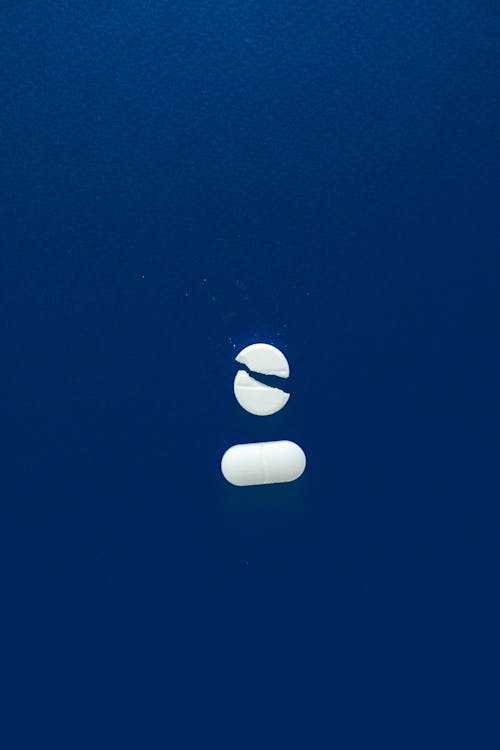 White Medicines on Blue Surface