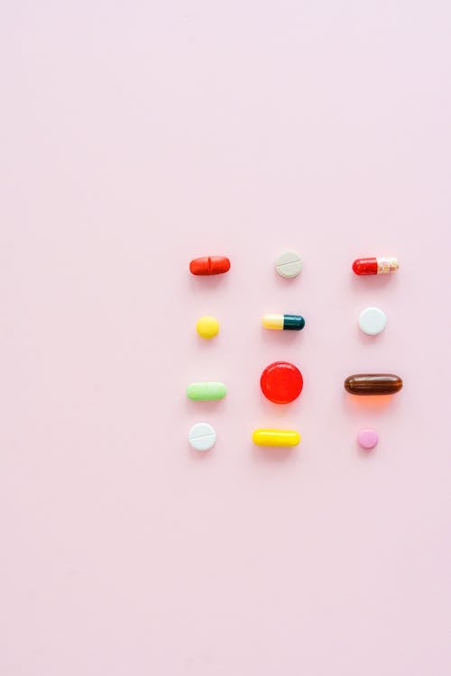 Pattern of Pills on Pink Background