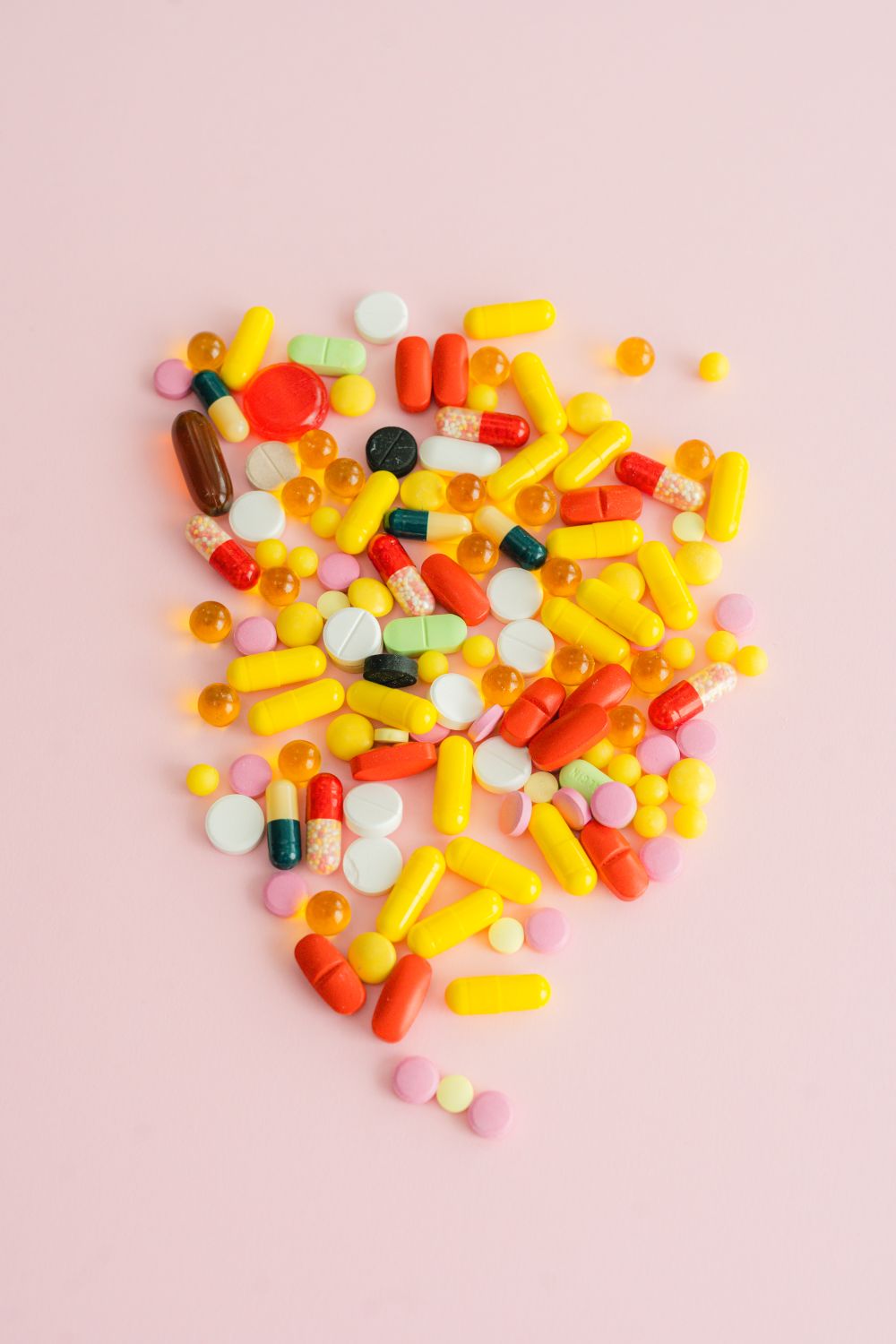 Assorted Medicines on Pink Surface · Free Stock Photo