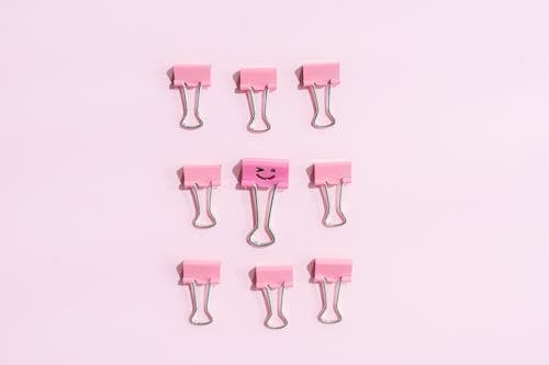 Lined Up Binder Clips in Close Up Photography