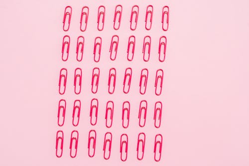 Free Lined Up Pink Paper Clips Stock Photo