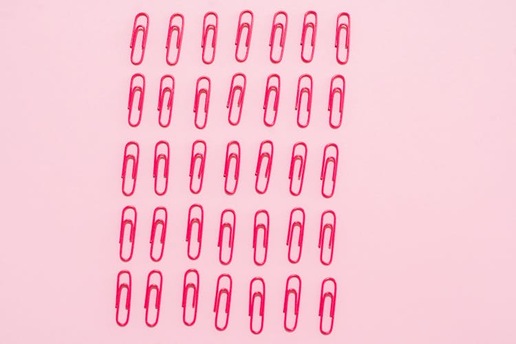 Lined Up Pink Paper Clips