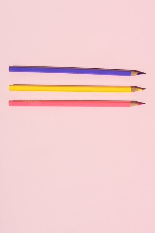 Free Colored Pencils on Pink Surface Stock Photo