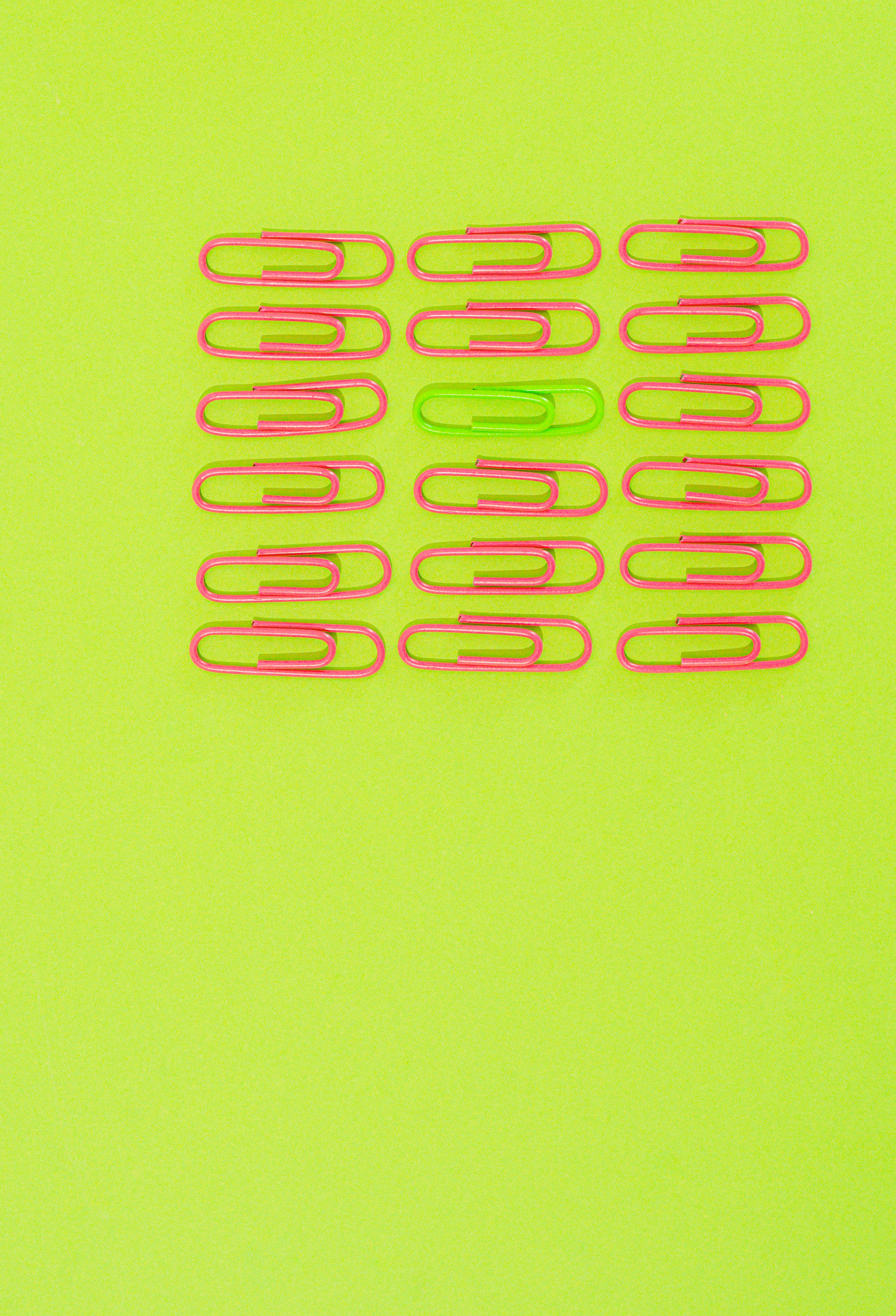 paper clips on green surface