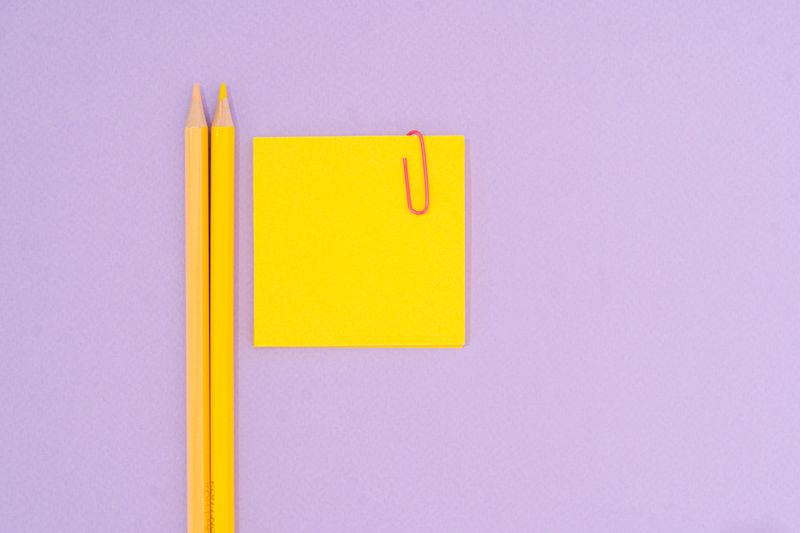 colorful sticky notes sorted by color on a desk
