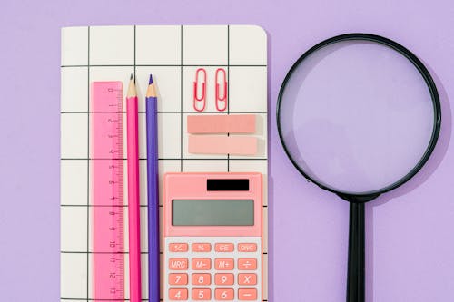 Office Supplies on Purple Background