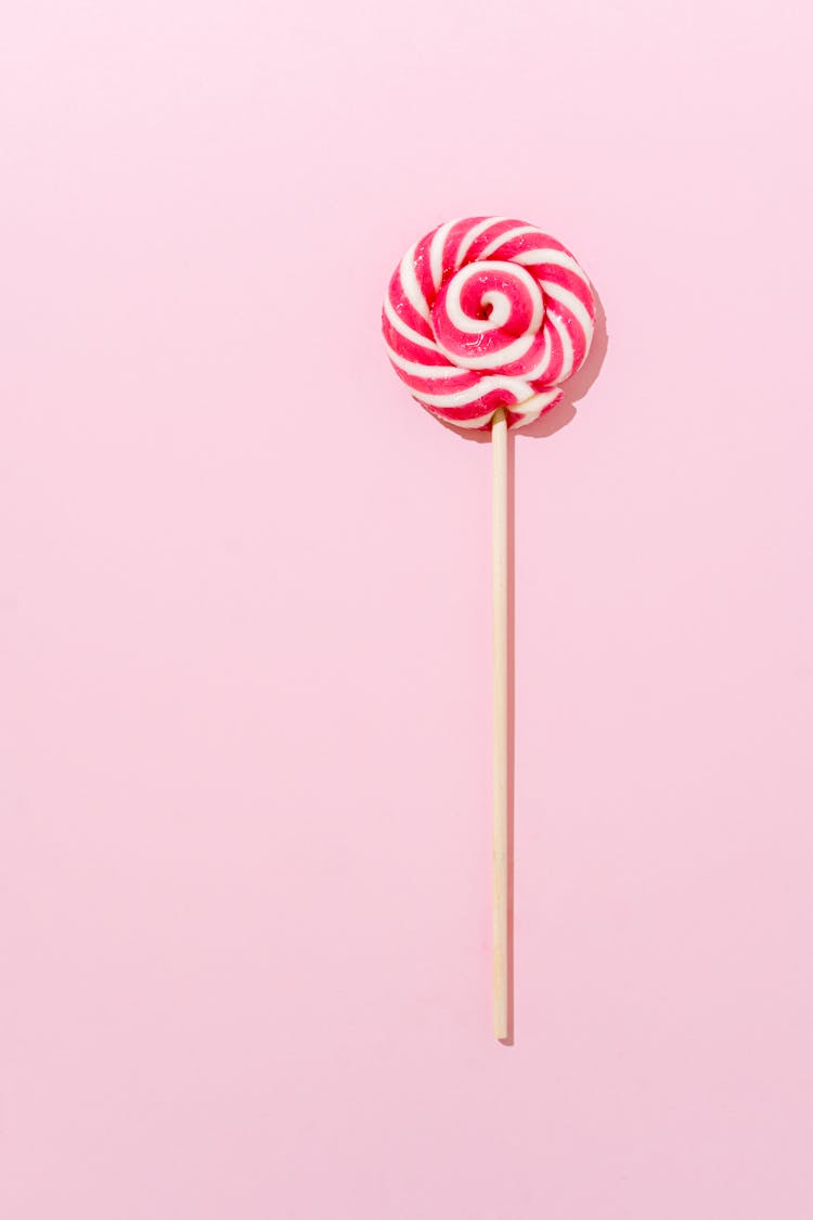 A Lollipop On Pink Surface