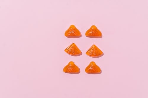 Free Gummy Candies on Pink Surface Stock Photo