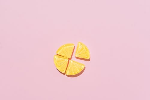 Free Yellow Jellybeans on Pink Background Stock Photo