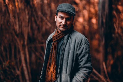 Man in Gray Jacket and Brown Scarf Wearing Hat 