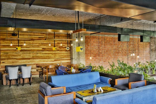 A contemporary café in Ahmedabad showcasing modern furniture and industrial elements.
