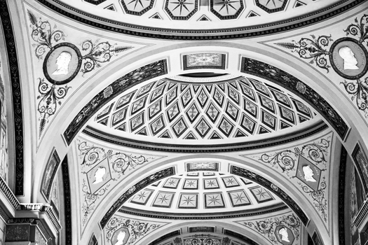 Stunning black and white photo of an intricately designed architectural dome with ornate patterns and details.