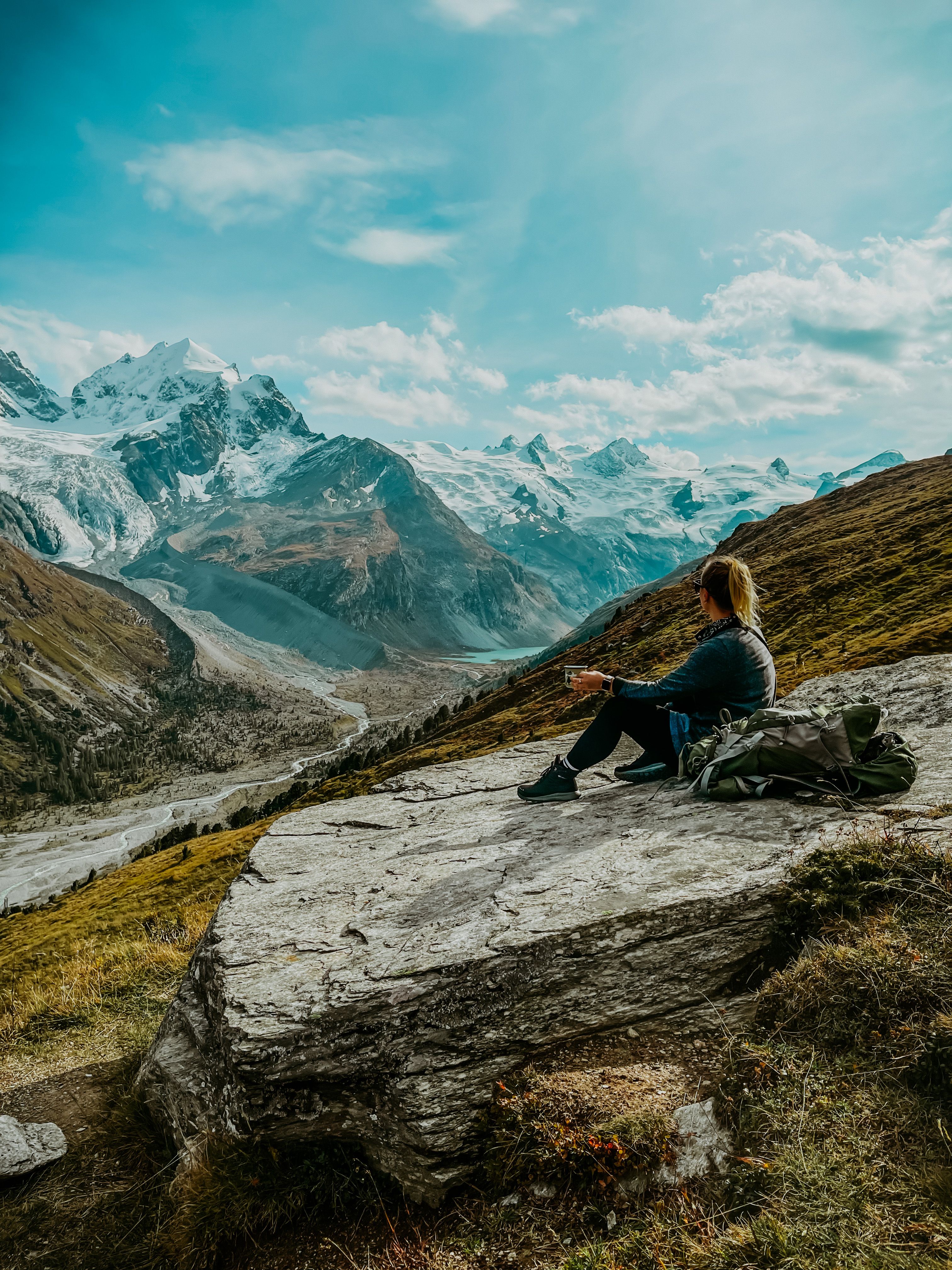Female Adventurer sitting on a Rock Formation · Free Stock Photo