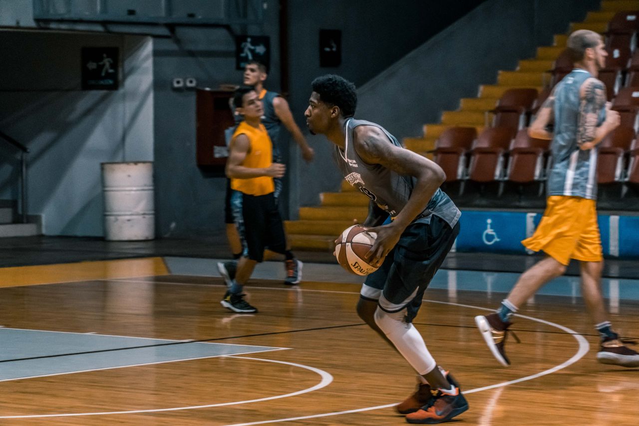 young athletes engage in a dynamic basketball practice indoors focused