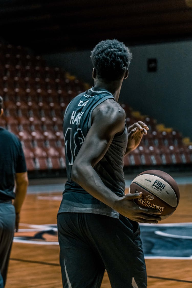 Man Holding Fiba Basketball