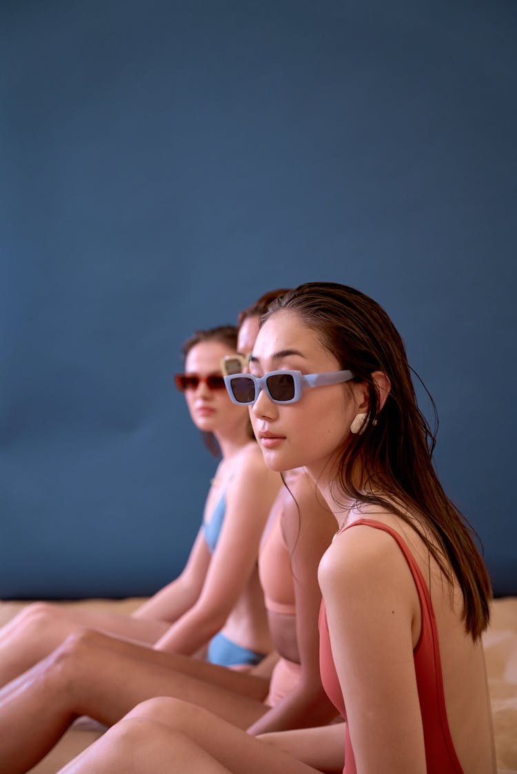 Women In Swimsuits Sitting 