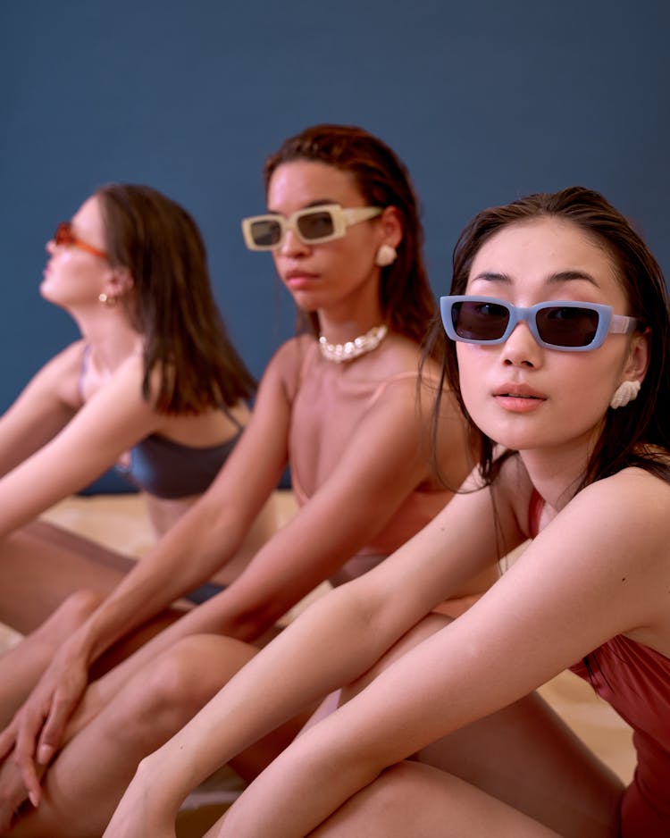 Women In Swimsuits Sitting