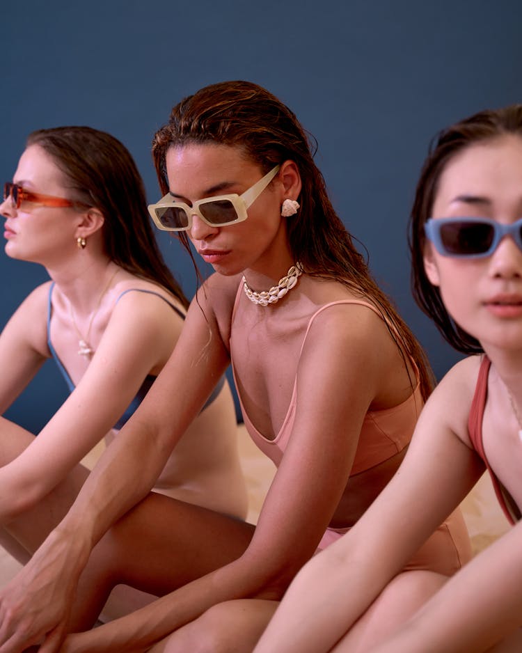 Women In Swimsuits Sitting