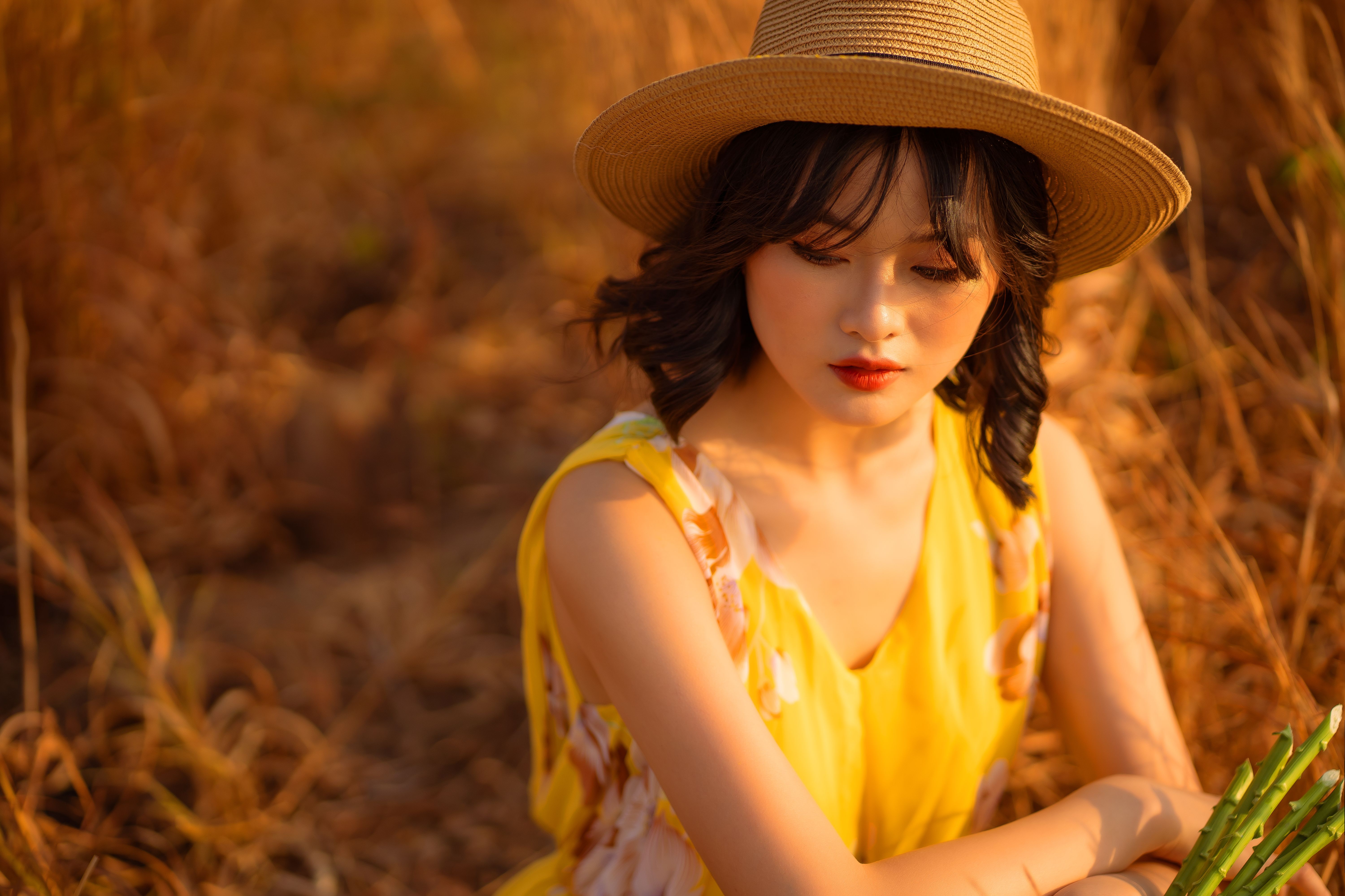 A Portrait of a Woman Wearing a Hat · Free Stock Photo