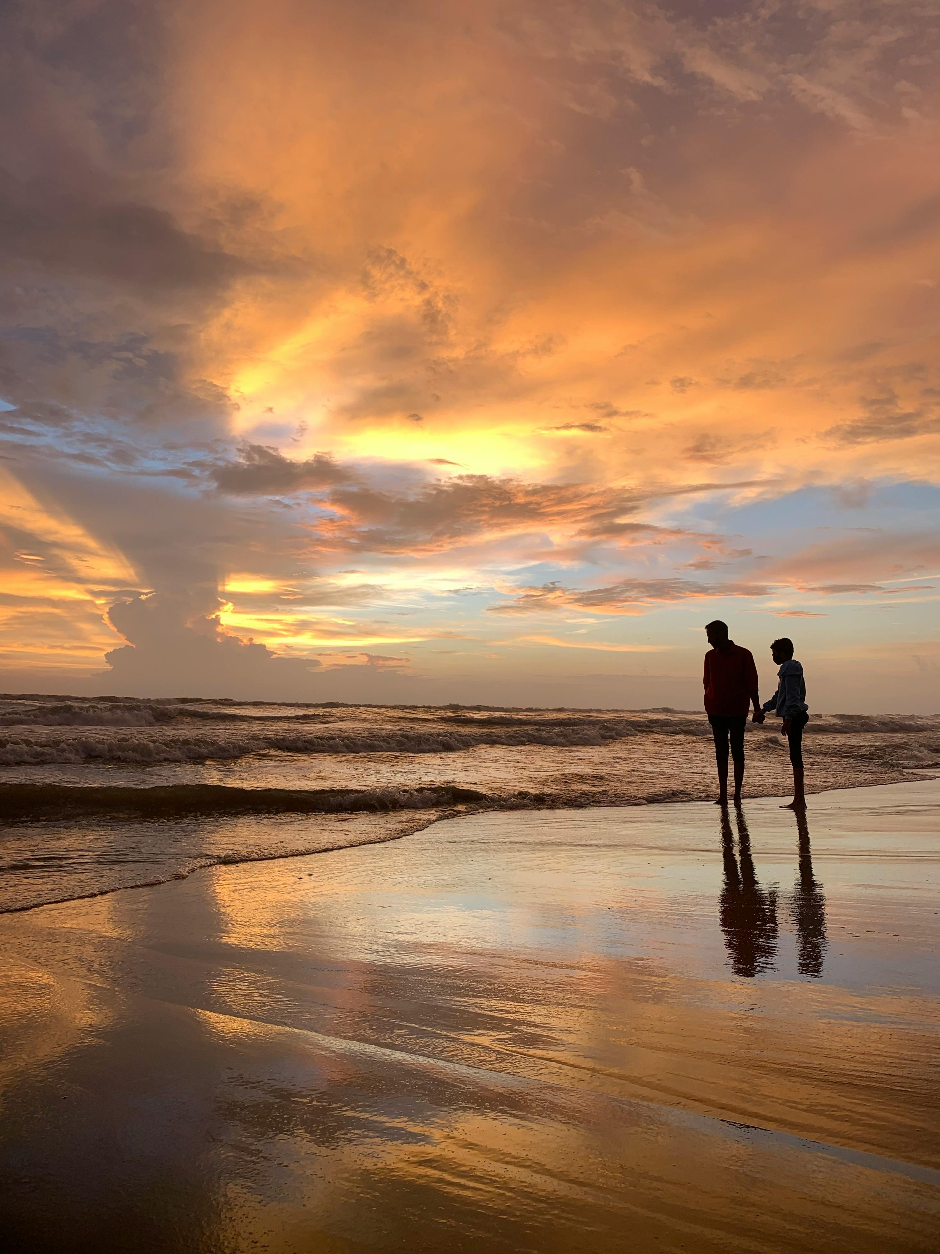 Silhouette of Two People Standing on the Beach during Sunset · Free Stock  Photo, image size:3024x4032