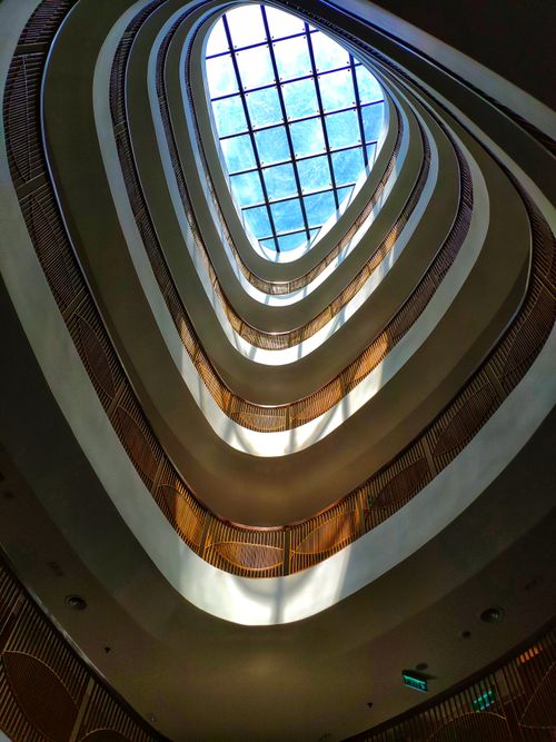 Free Striking architectural view of a modern atrium with natural light in Đà Lạt, Vietnam. Stock Photo