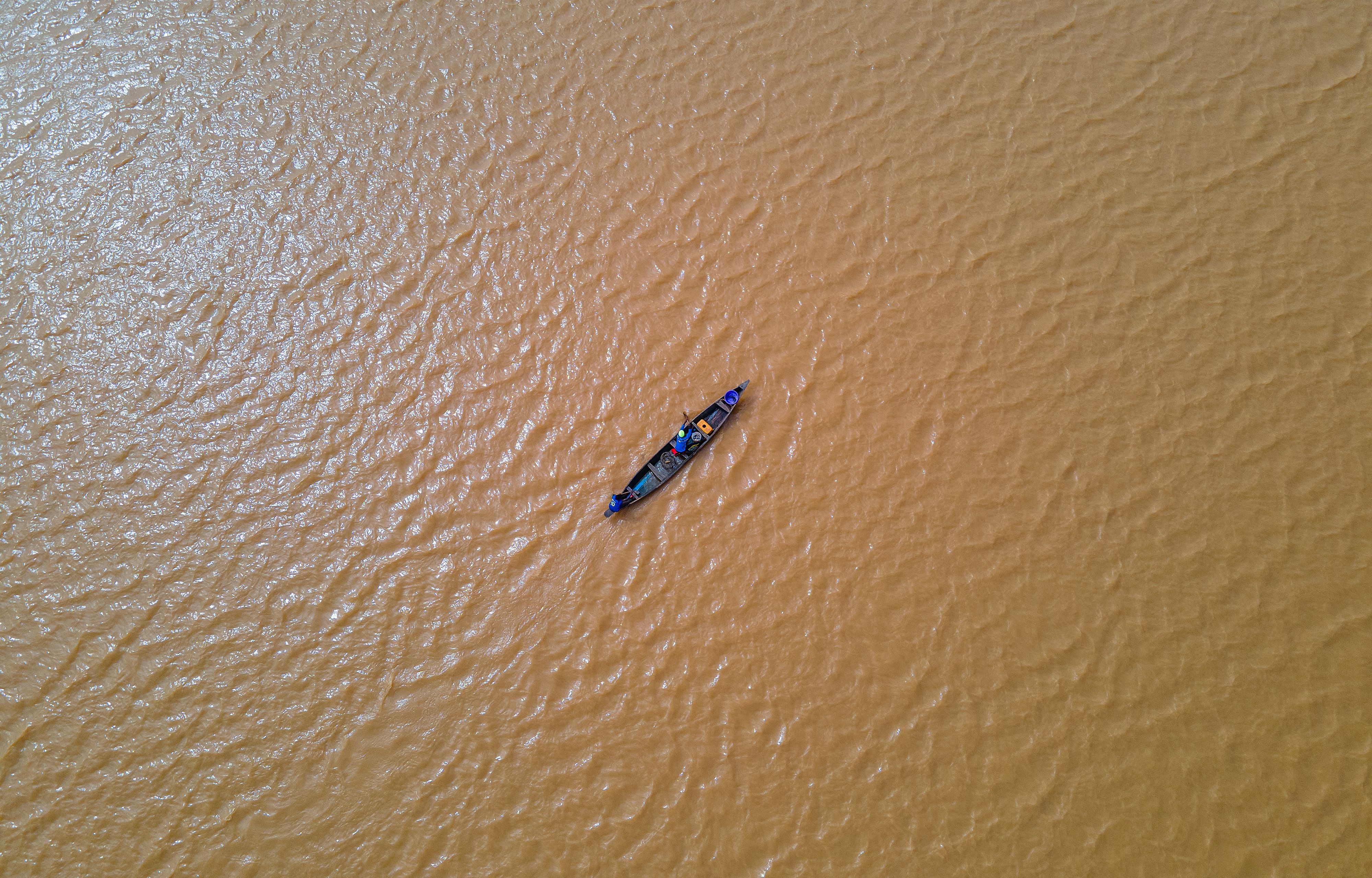Aerial Photography of People Riding a Boat on the River · Free Stock Photo