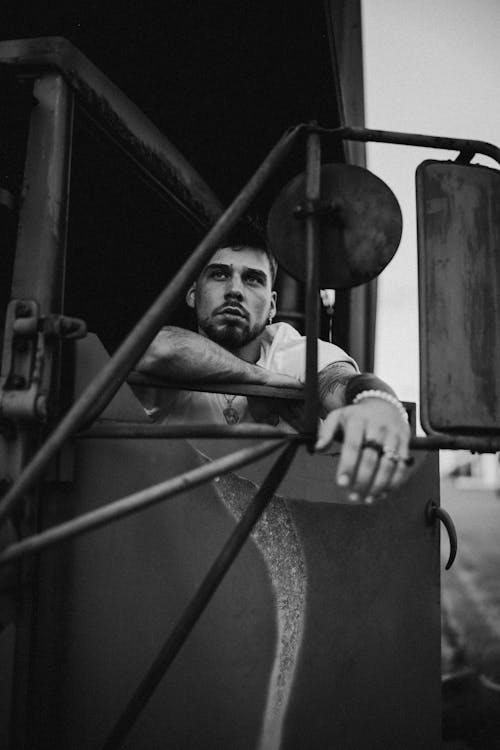 Black and white portrait of man in truck