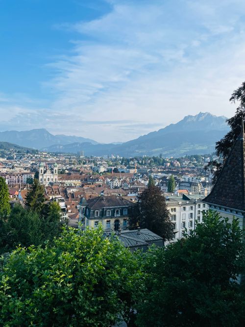 Free Panoramic view of a picturesque European town with mountainous backdrop. Stock Photo