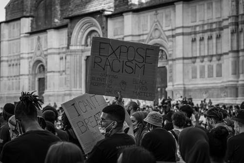 Grayscale Photo of People Protesting 