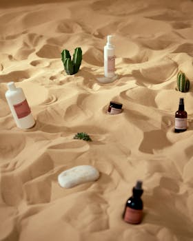 Creative skincare products presented on a desert sand backdrop for a unique visual experience.