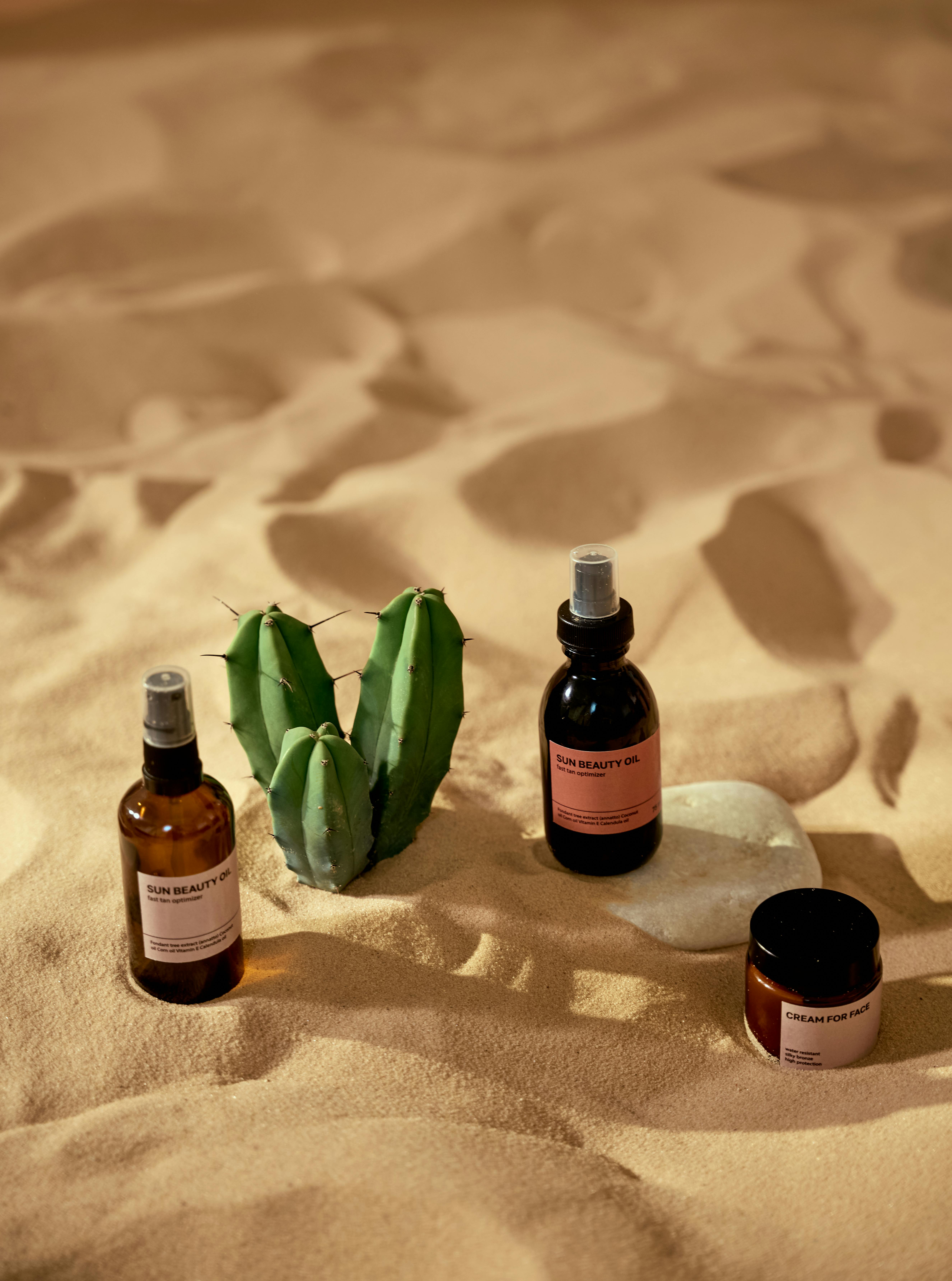 cosmetic products on a beach sand