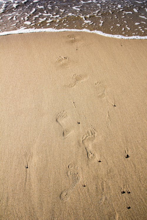 Beach Sand With Footprints