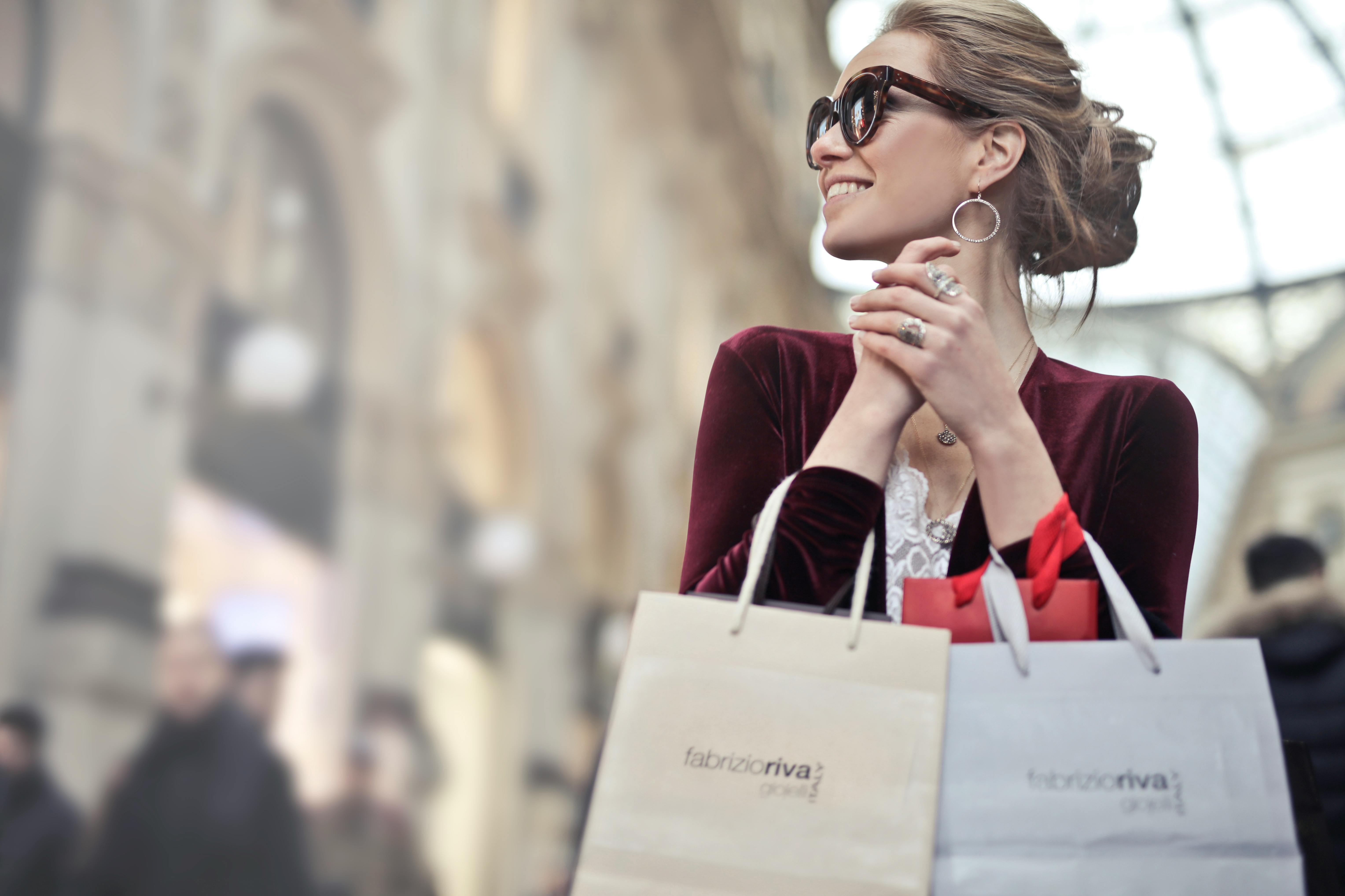 Woman holding shopping discount bags