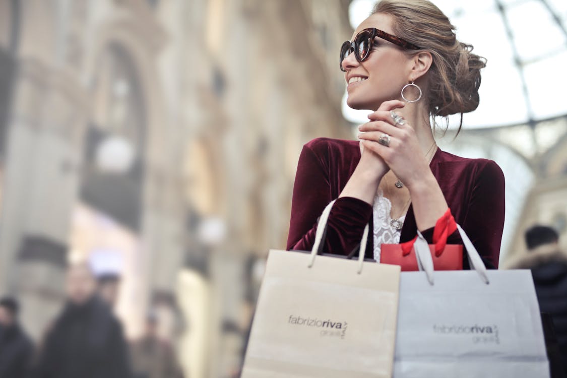 Free Photo of a Woman Holding Shopping Bags Stock Photo