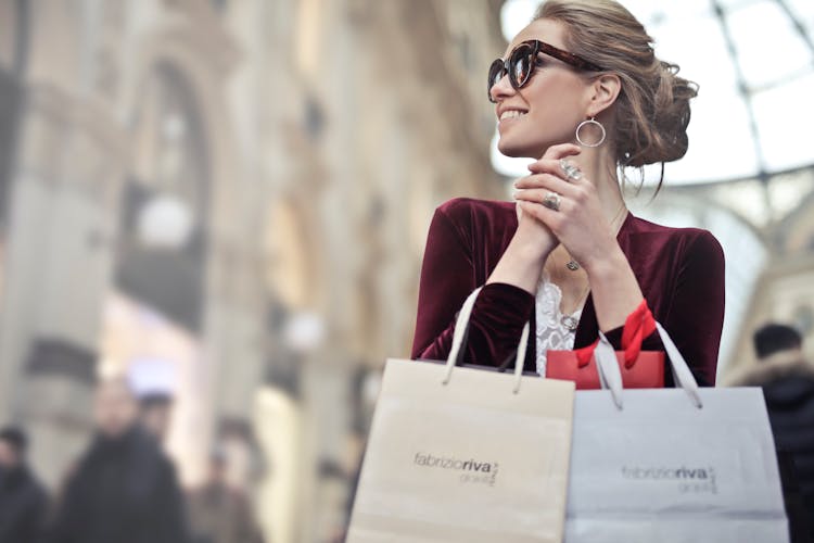 Photo Of A Woman Holding Shopping Bags