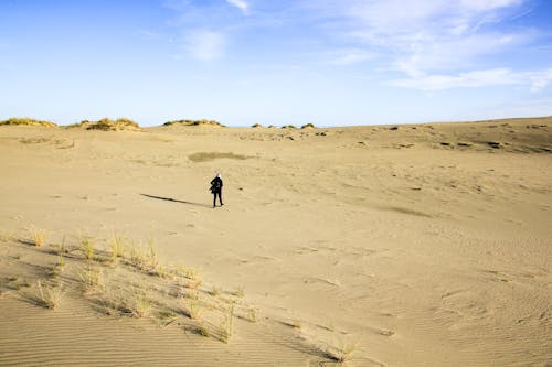 Person Walking on the Desert