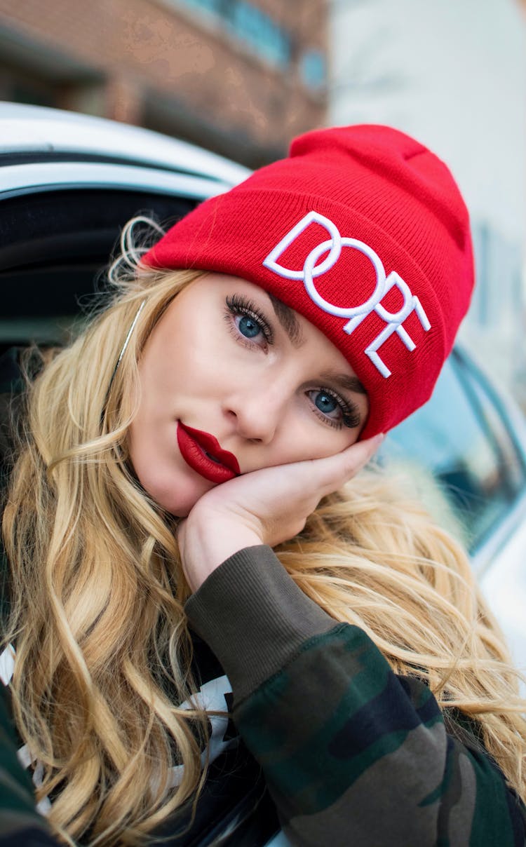 Blonde In Beanie Looking Out Of Car Window