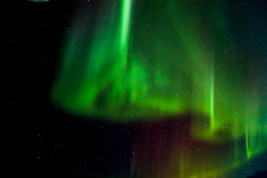 Captivating Aurora Borealis lights up the night sky over Slave Lake, Canada.