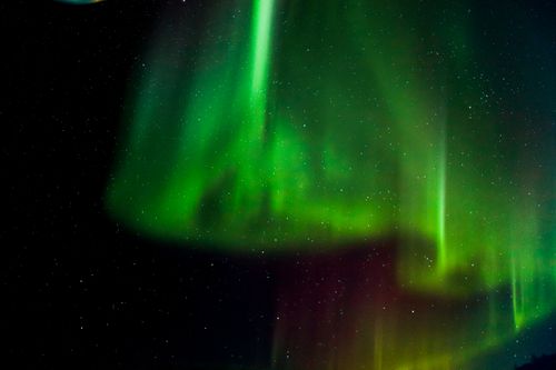 Free Captivating Aurora Borealis lights up the night sky over Slave Lake, Canada. Stock Photo