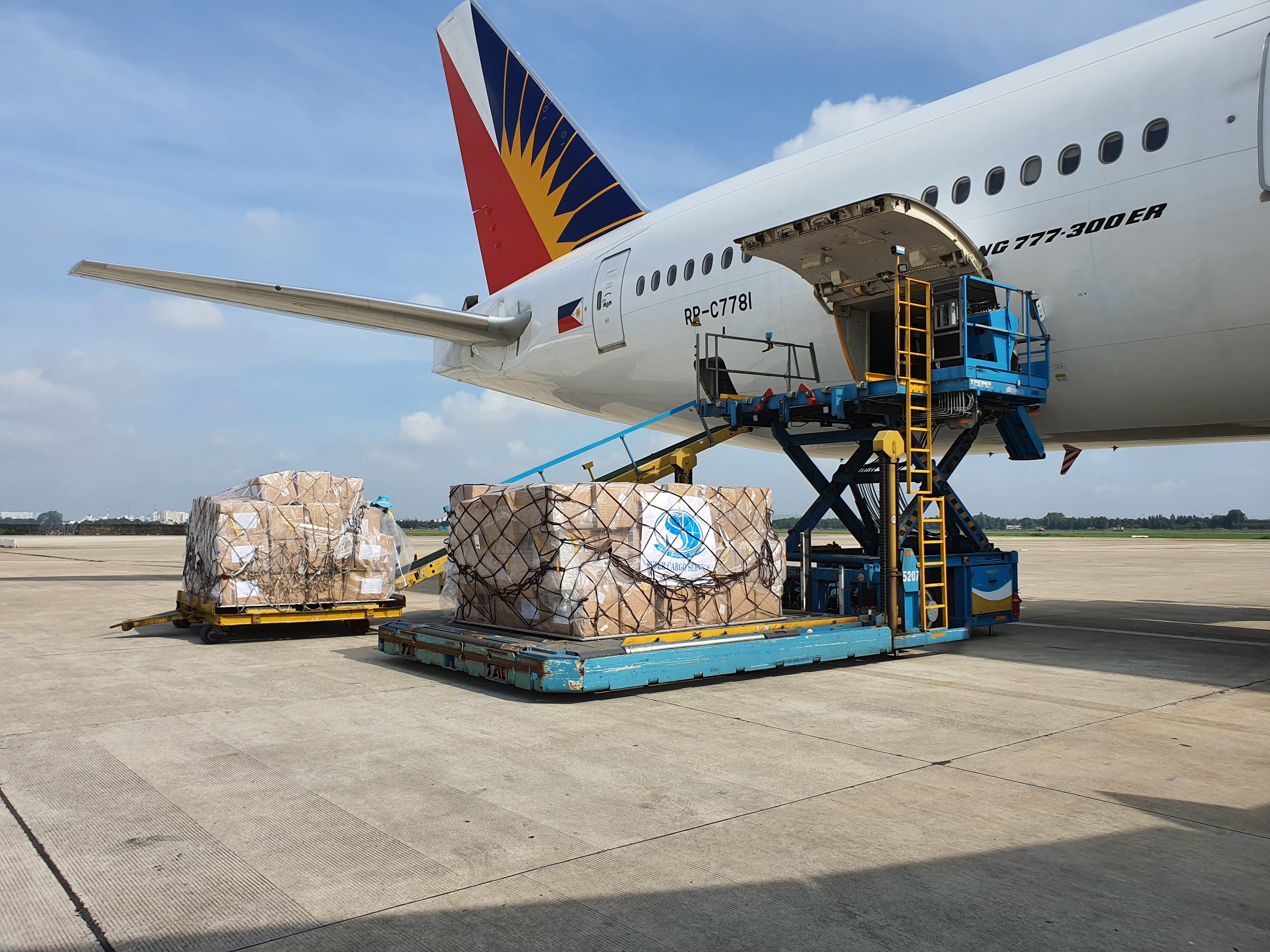 Cargo being loaded onto a commercial airplane in Ho Chi Minh City