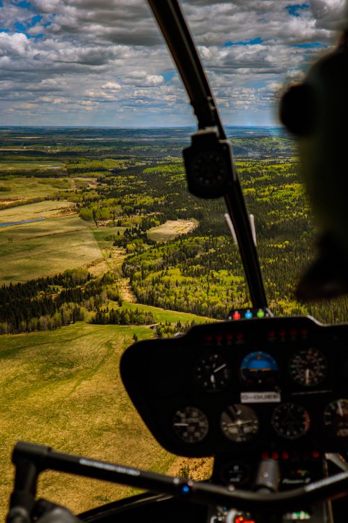 Free Scenic view of lush landscapes from a helicopter cockpit, Bragg Creek, AB. Stock Photo