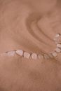 White and Silver Beaded Bracelet on Brown Sand