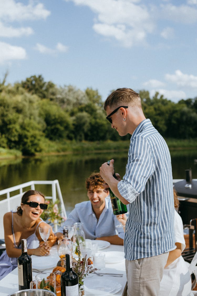 Couples Having Dinner On A Yacht