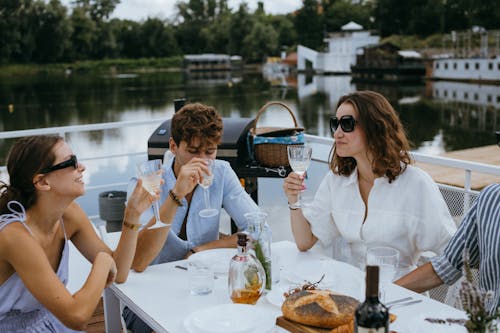 Free Friends Drinking Champagne on a Yacht Stock Photo