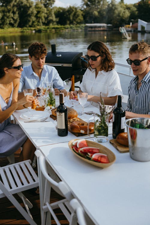 Free People Sitting by the Table Stock Photo